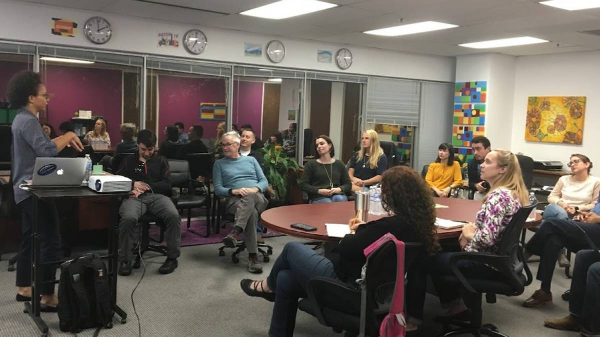 Michelle Williams leads AIR participants through a meeting.